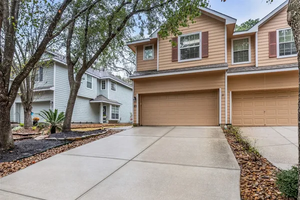 a front view of a house with a garage