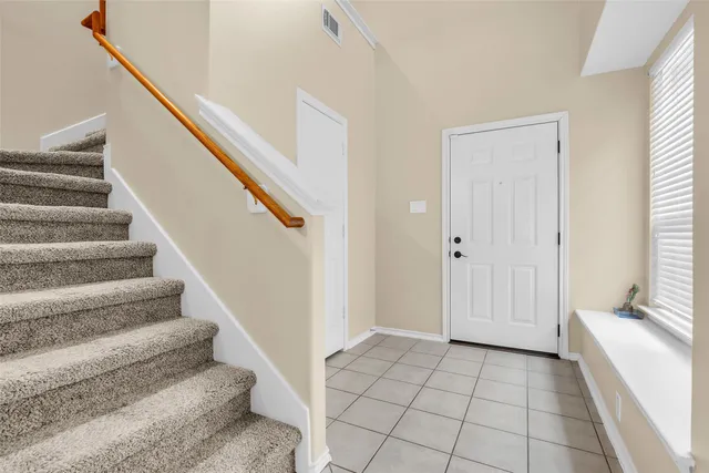 a view of an entryway with staircase