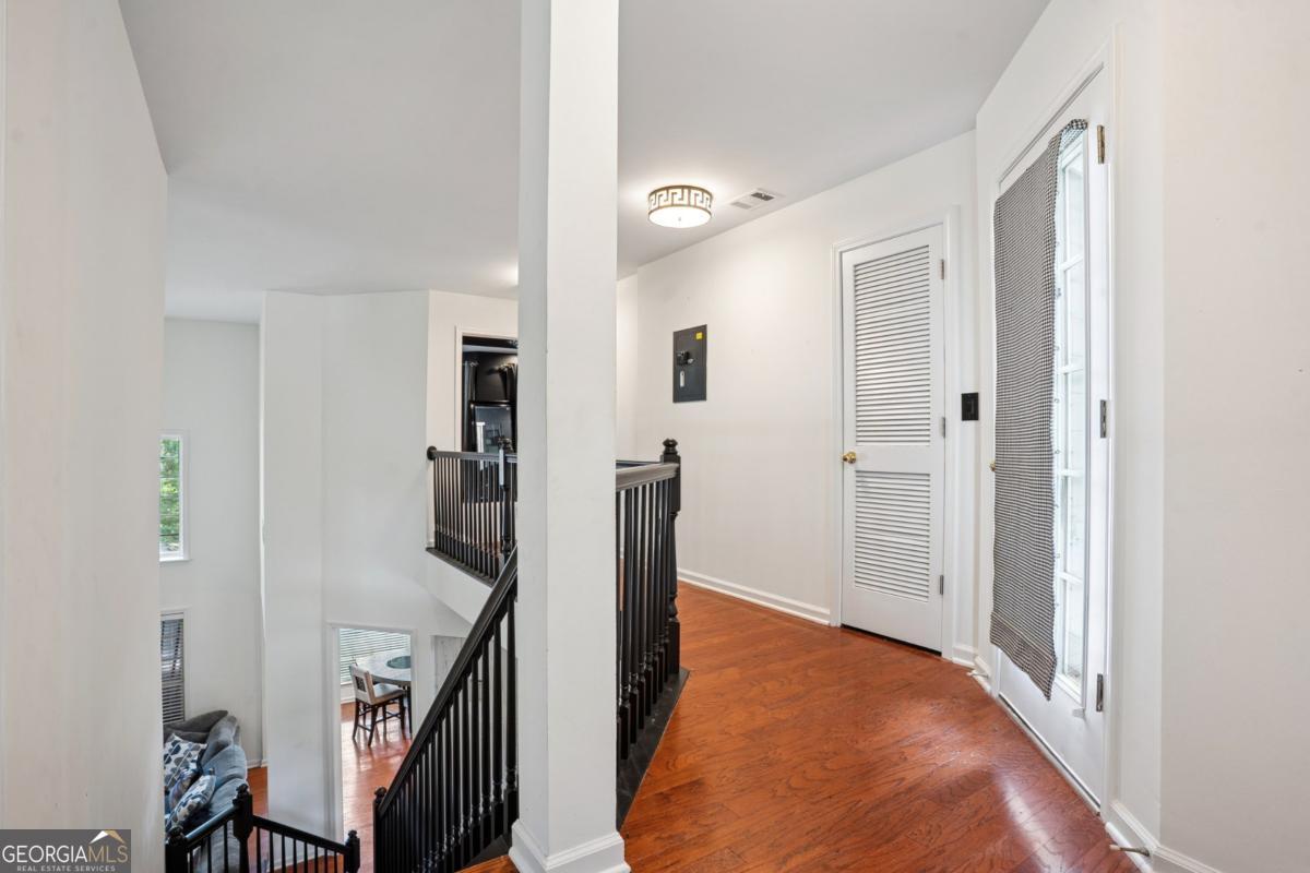 1229 Crescentwood Lane Decatur, GA 30032 - Photo 11 of 25 a view of a hallway with closet and wooden floor