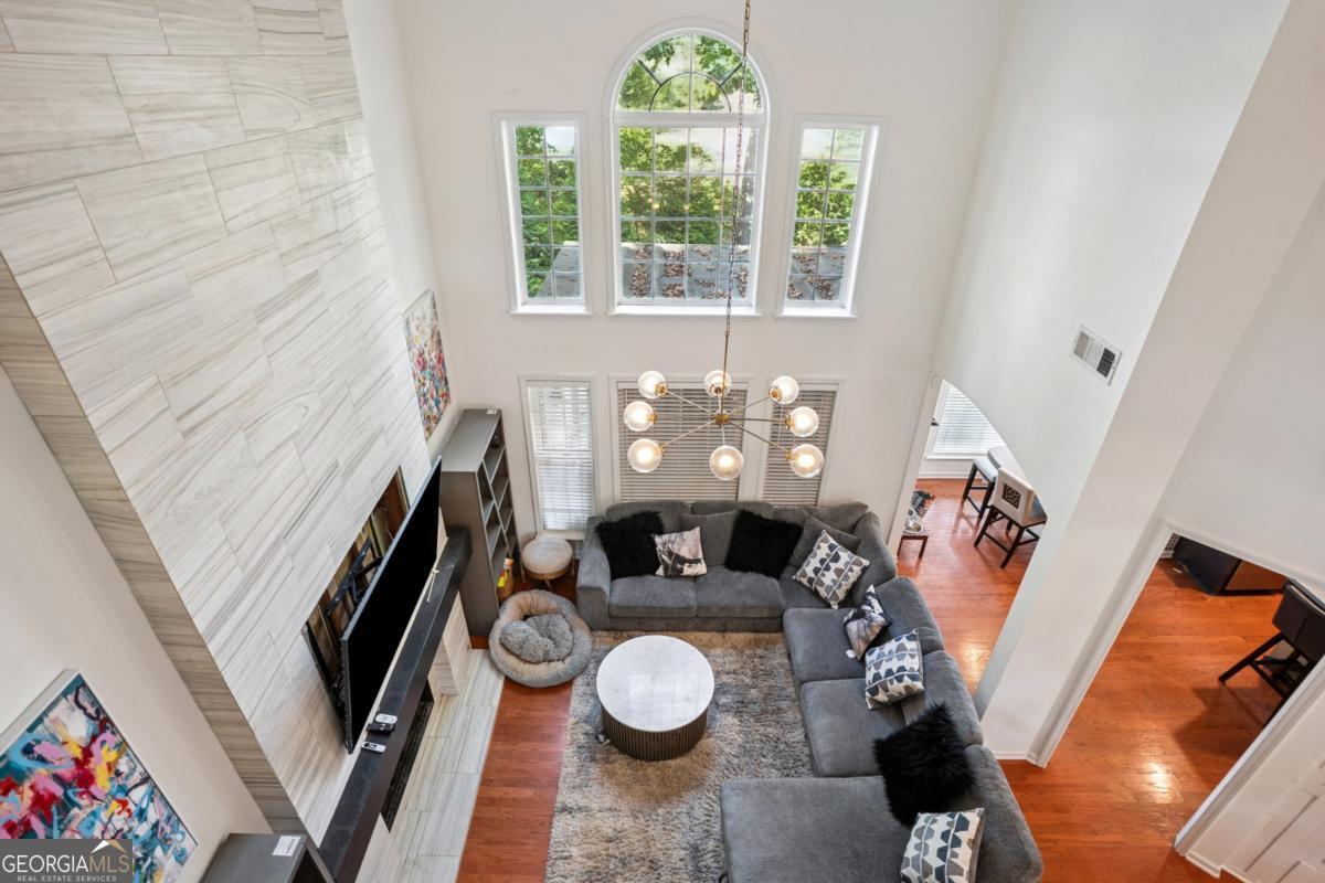 1229 Crescentwood Lane Decatur, GA 30032 - Photo 12 of 25 a living room with furniture and a floor to ceiling window