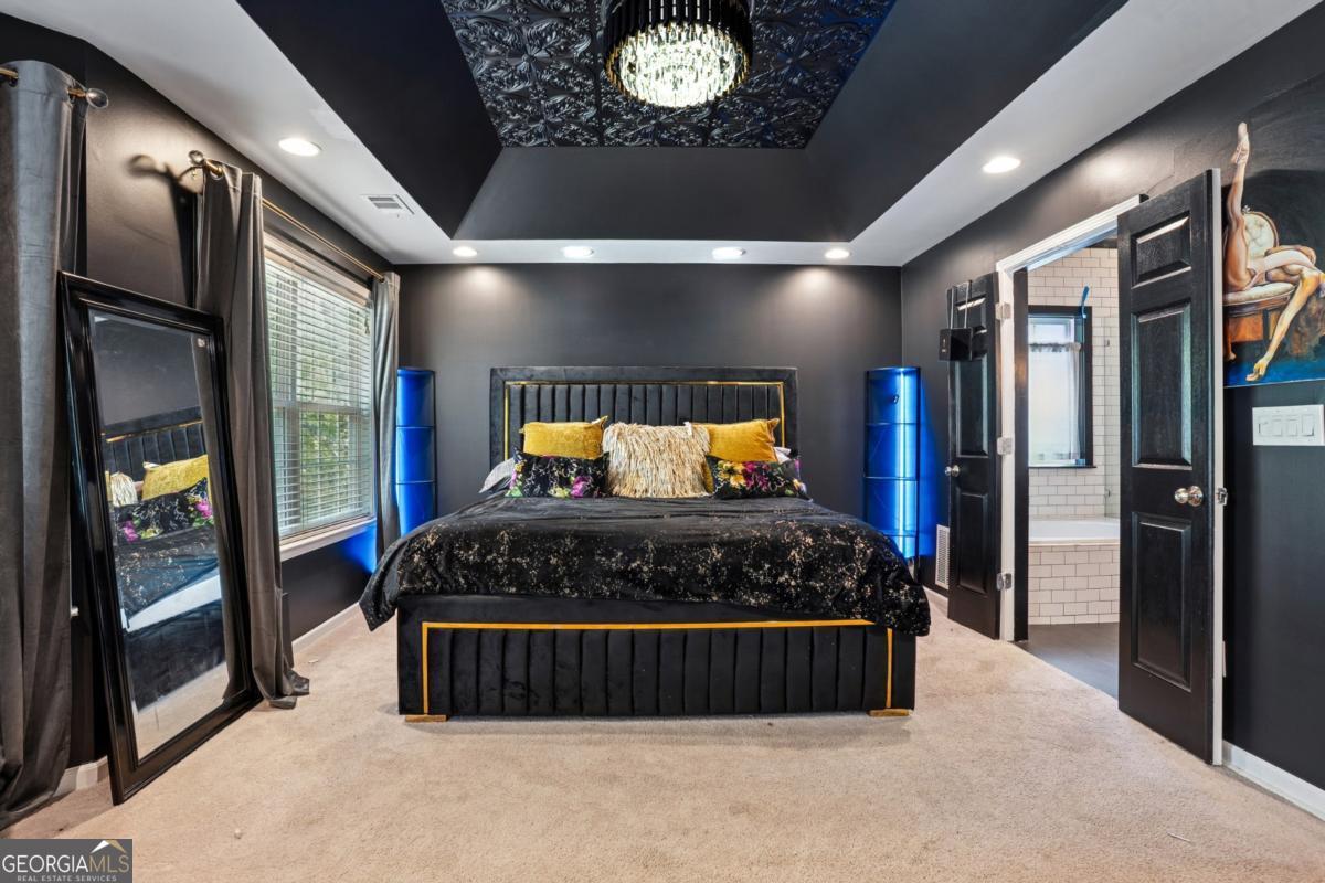 1229 Crescentwood Lane Decatur, GA 30032 - Photo 15 of 25 a bedroom with a large bed and a large window