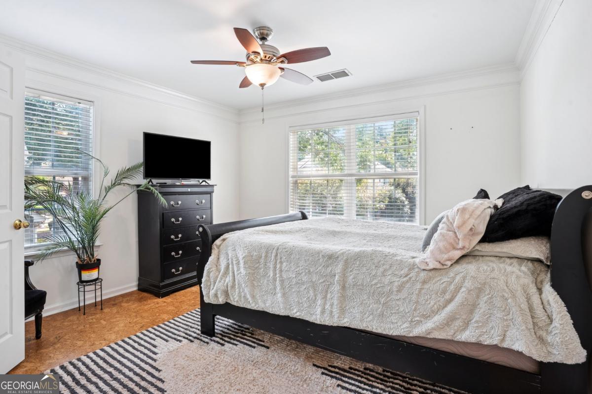 1229 Crescentwood Lane Decatur, GA 30032 - Photo 19 of 25 a bedroom with a bed and a flat screen tv