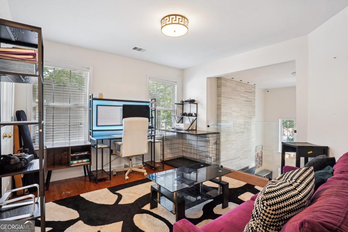 1229 Crescentwood Lane Decatur, GA 30032 - Photo 21 of 25 a living room with furniture and a lamp