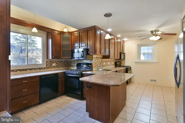 a kitchen with a sink cabinets and window