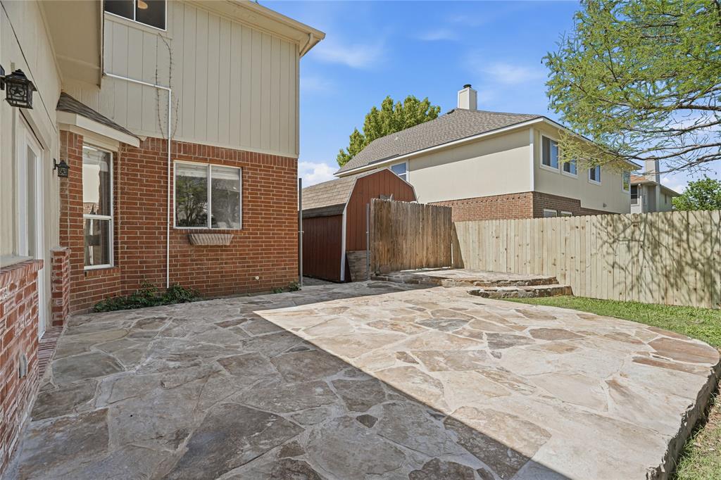 2133 Rustic Ridge Drive Keller, TX 76248 - Photo 38 of 40 Fenced backyard with a patio and a shed
