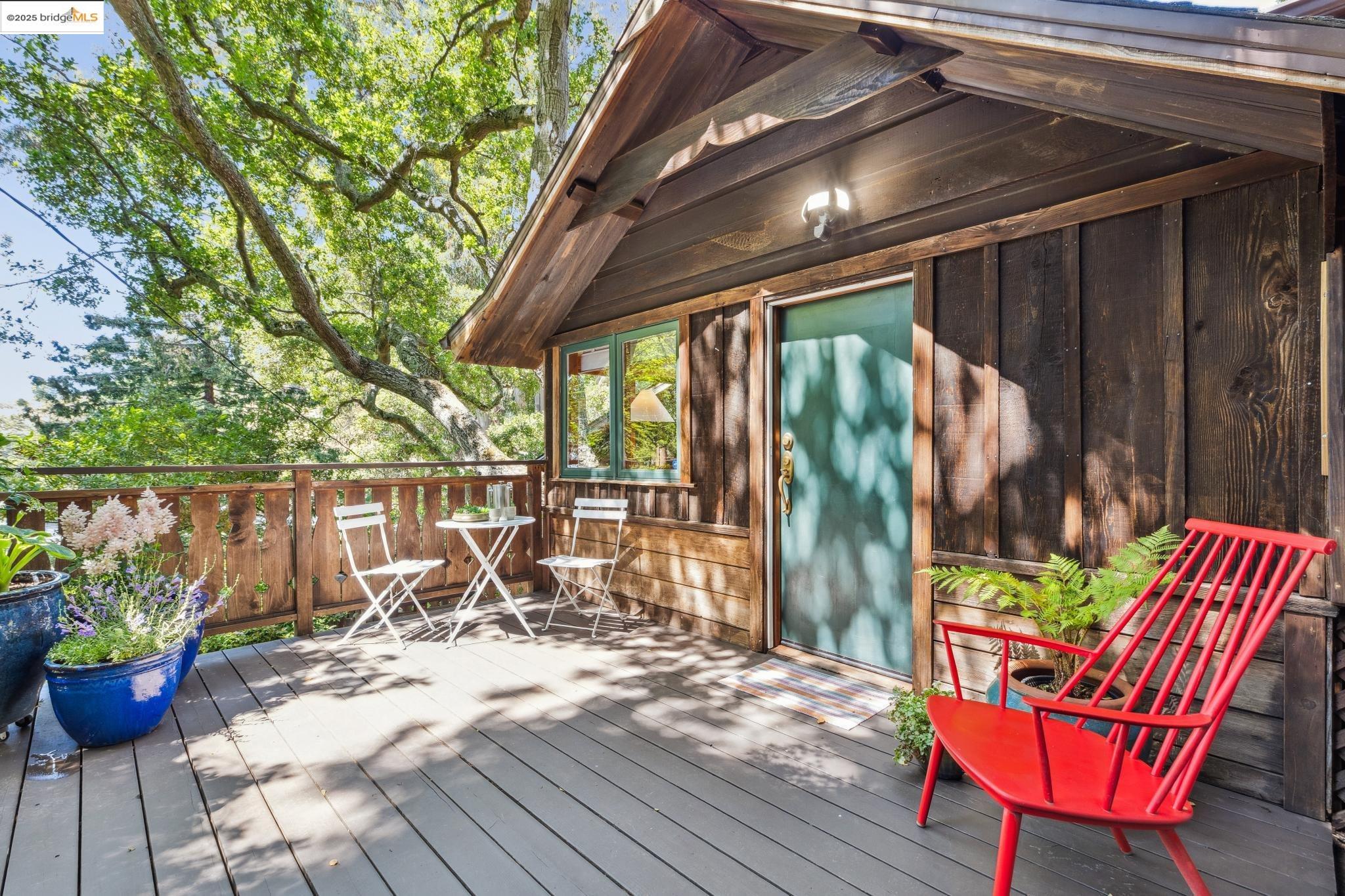49 Canyon Road Berkeley, CA 94704 - Photo 1 of 1 a view of balcony with chairs and wooden fence