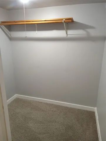 en empty room with windows and closet