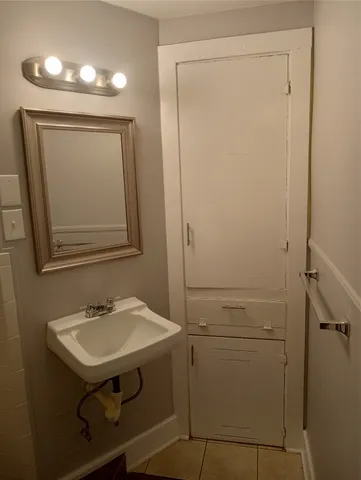 a white toilet sitting next to a bathroom sink