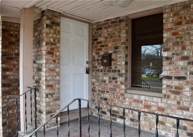 a kitchen with sink cabinets and wooden floor