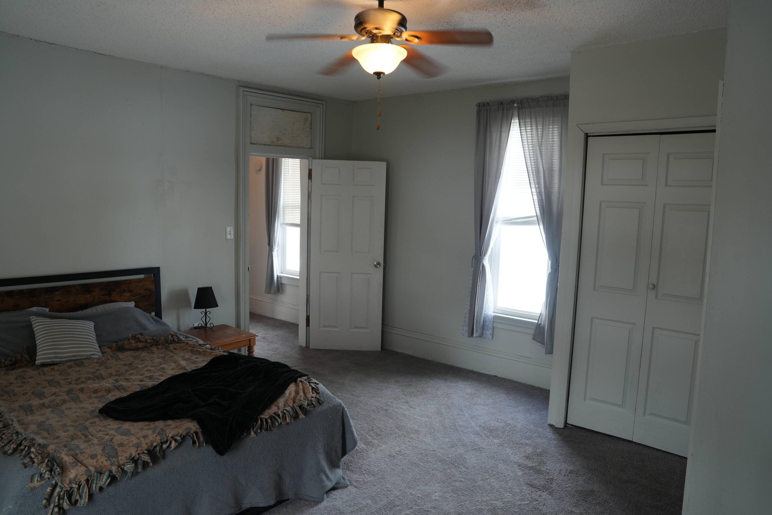 1002 Franklin Avenue Rochester, IN 46975 - Photo 11 of 15 a bedroom with a bed and a window