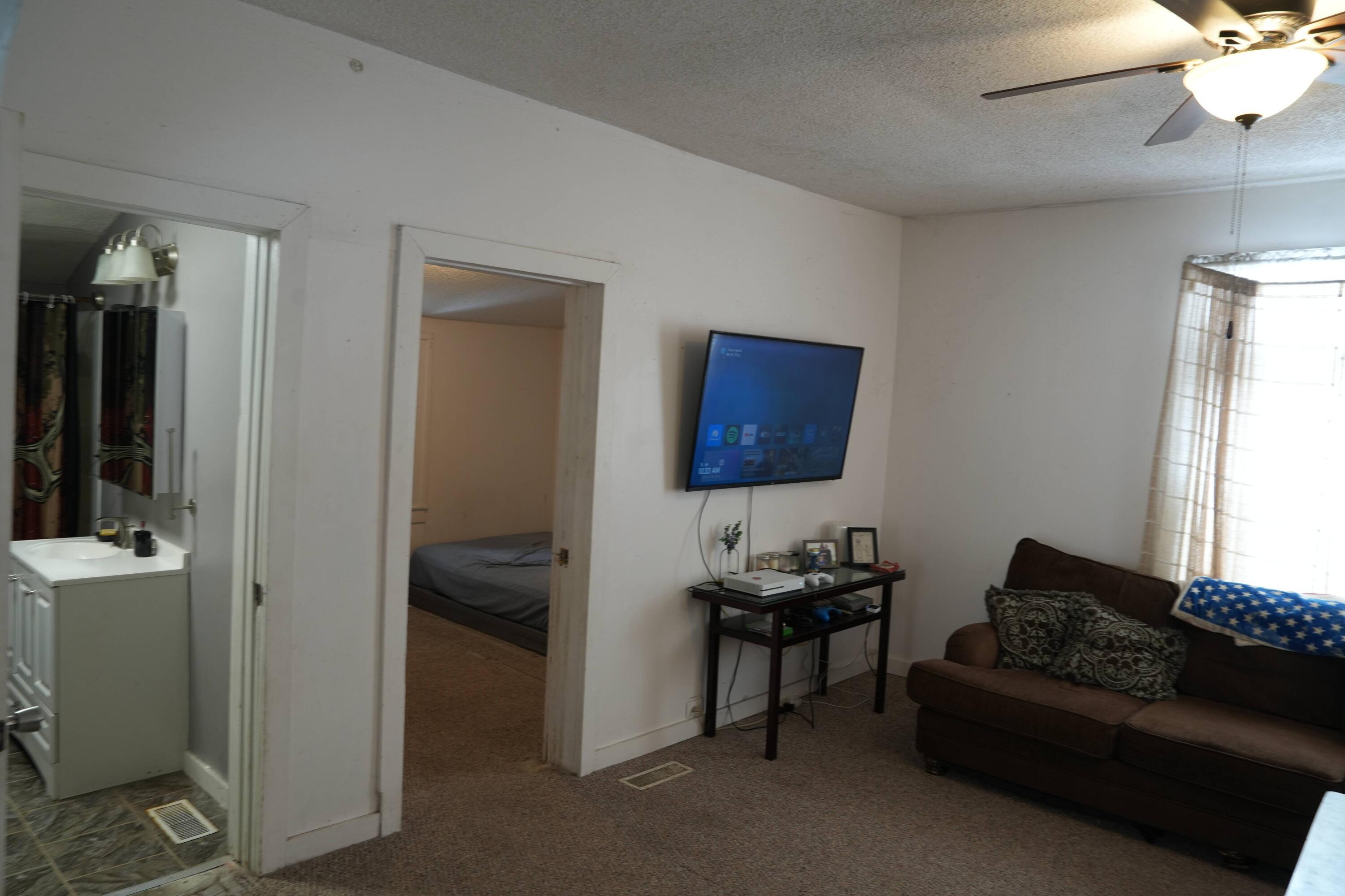 1002 Franklin Avenue Rochester, IN 46975 - Photo 4 of 15 a living room with furniture and a window