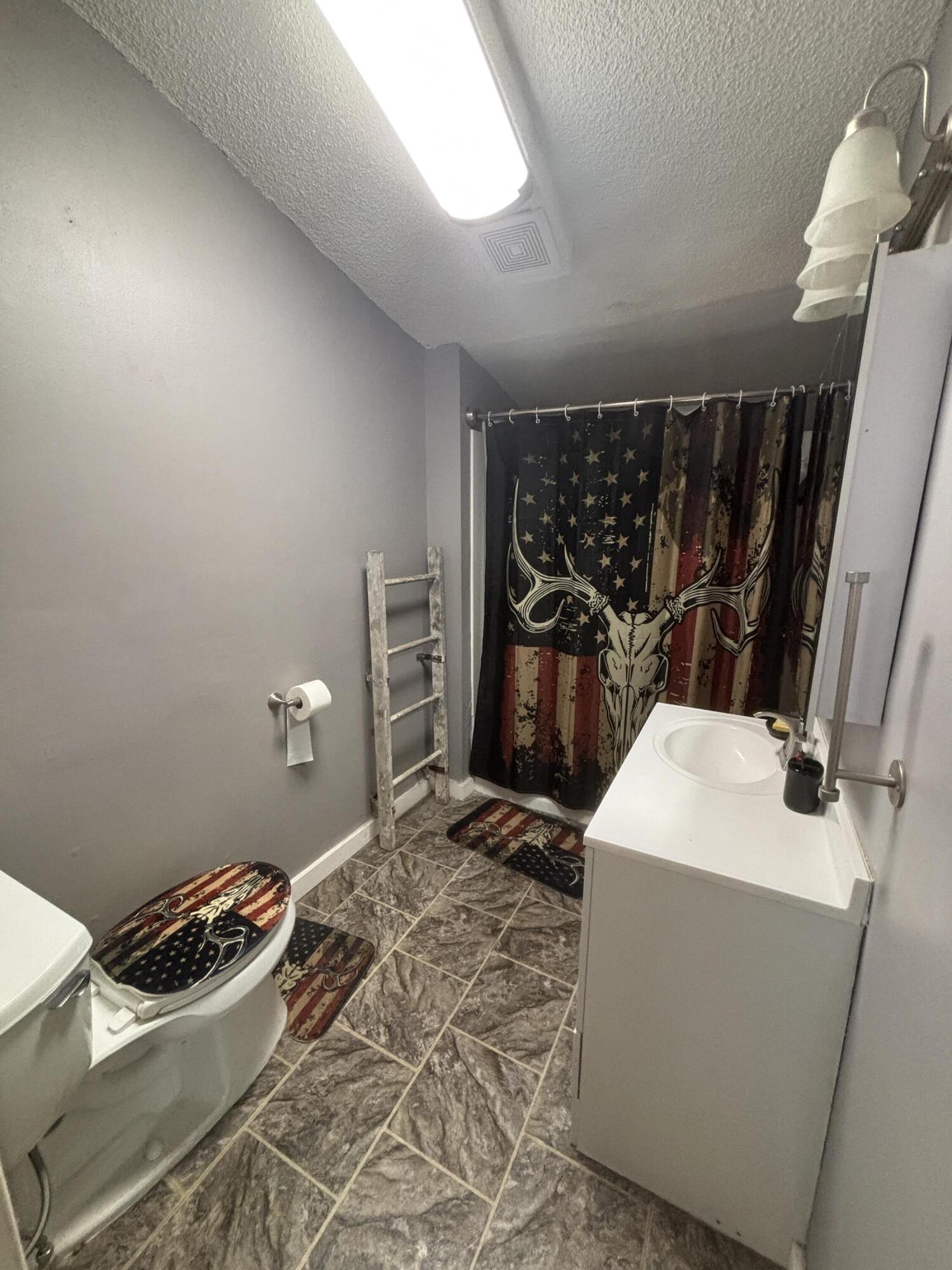 1002 Franklin Avenue Rochester, IN 46975 - Photo 6 of 15 a room with storage and utility