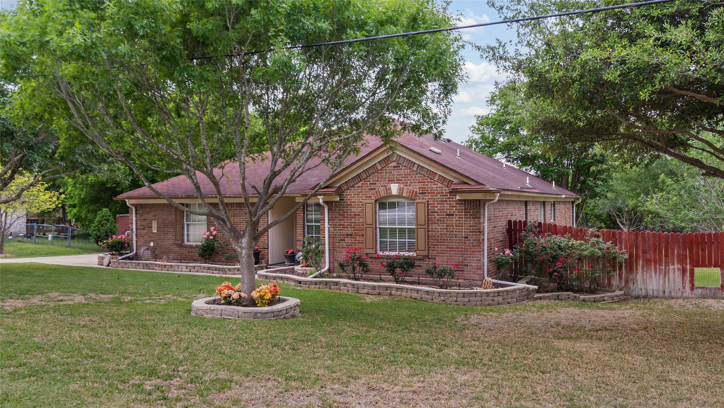 a front view of a house with garden