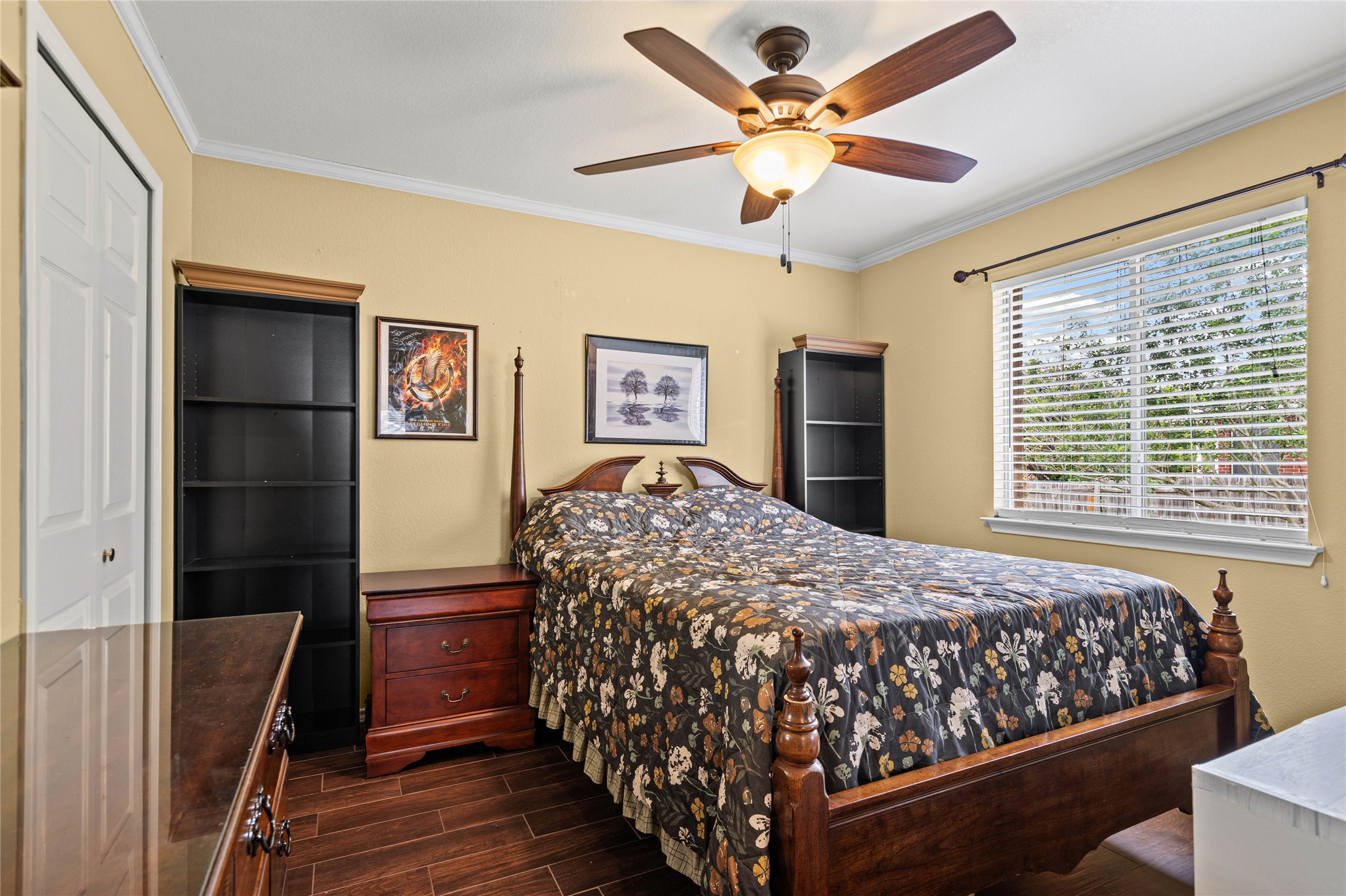 315 Appleton Court Buda, TX 78610 - Photo 12 of 28 a bedroom with a large bed and a chandelier