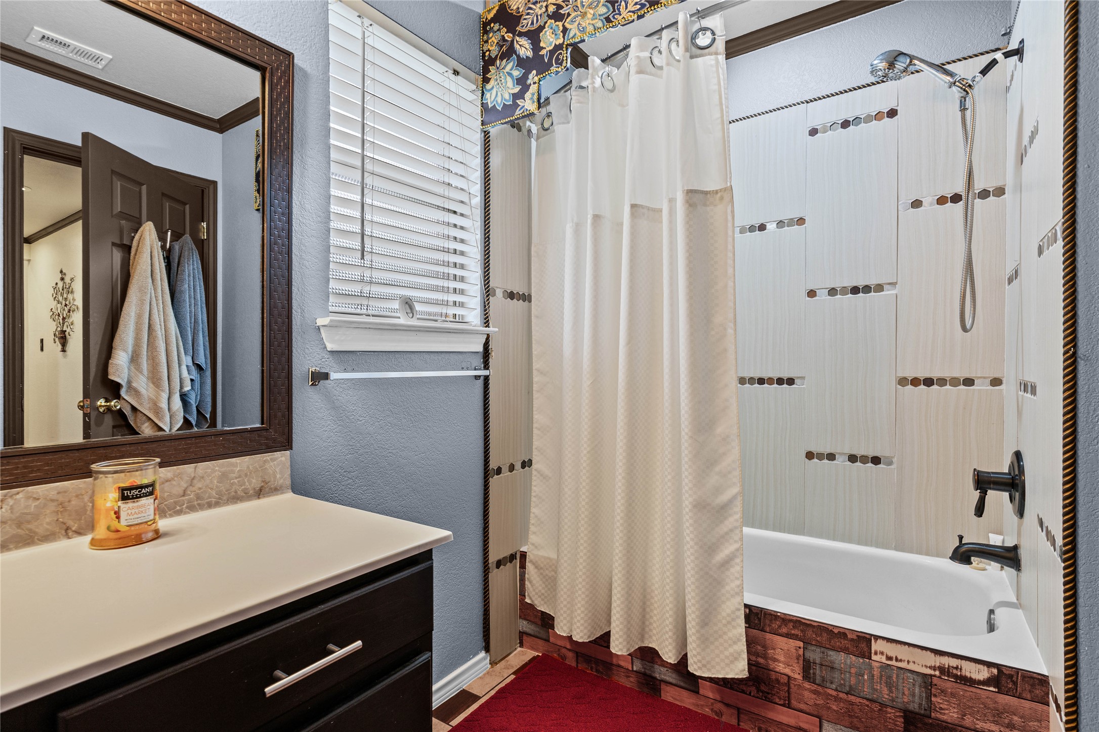 315 Appleton Court Buda, TX 78610 - Photo 14 of 28 a bathroom with a sink and a mirror