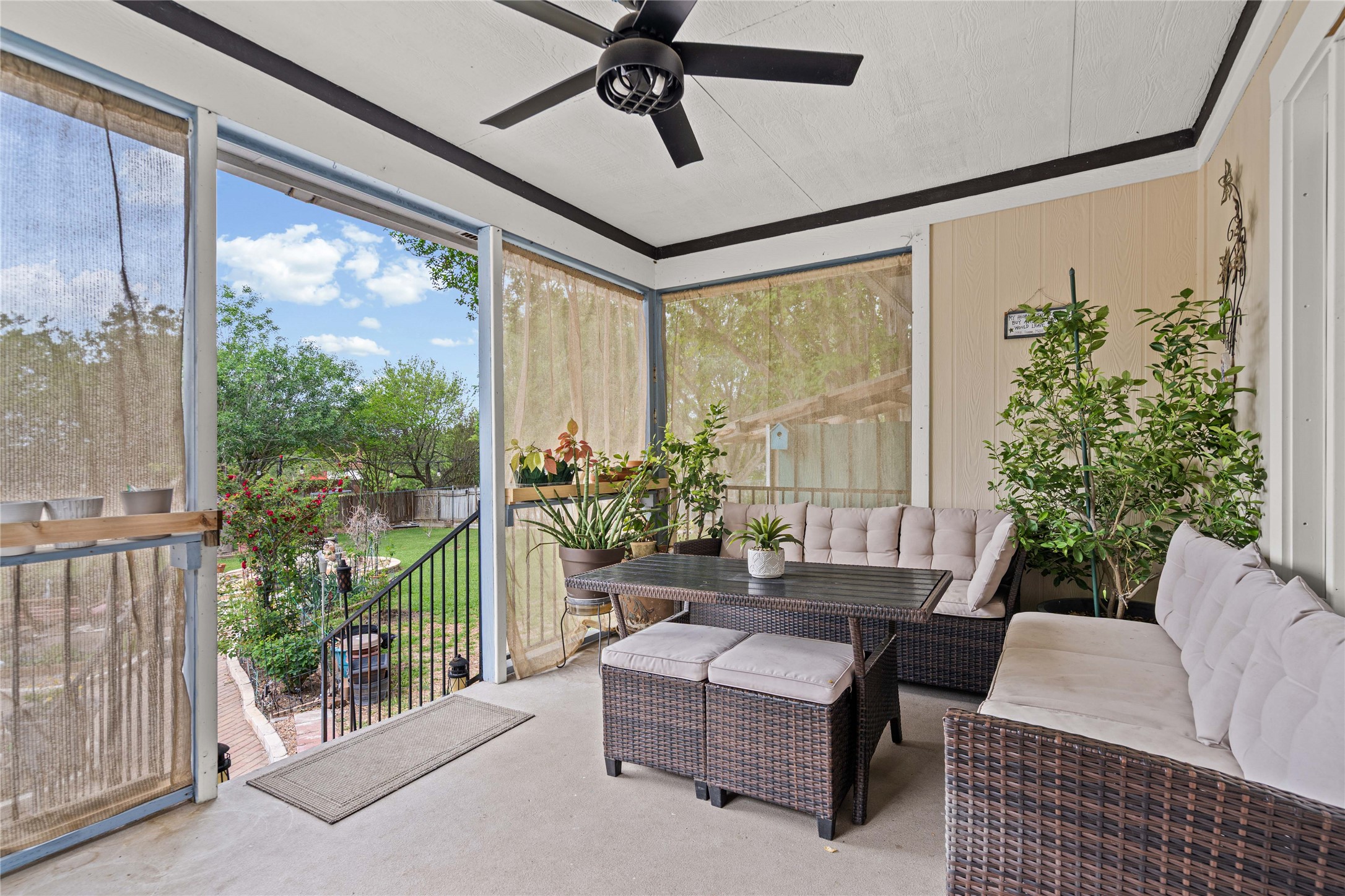 315 Appleton Court Buda, TX 78610 - Photo 15 of 28 a living room with furniture and a floor to ceiling window