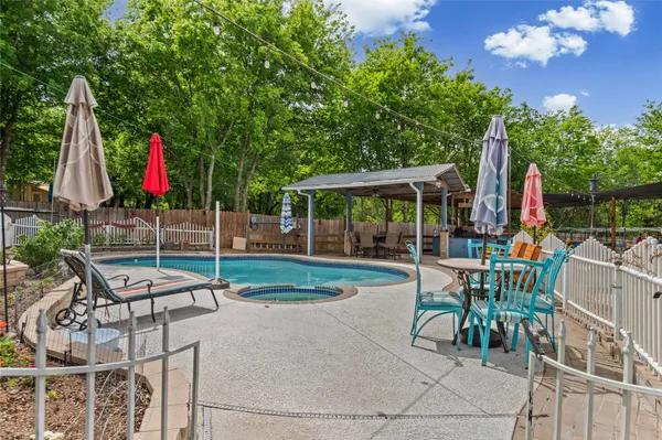 a view of a backyard with sitting area and slide