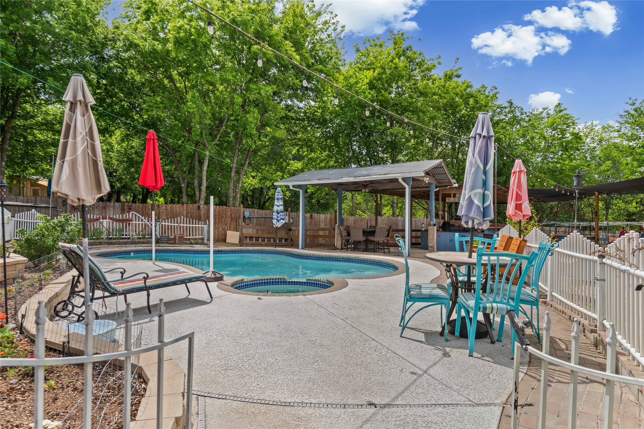 315 Appleton Court Buda, TX 78610 - Photo 16 of 28 a view of a backyard with sitting area and slide
