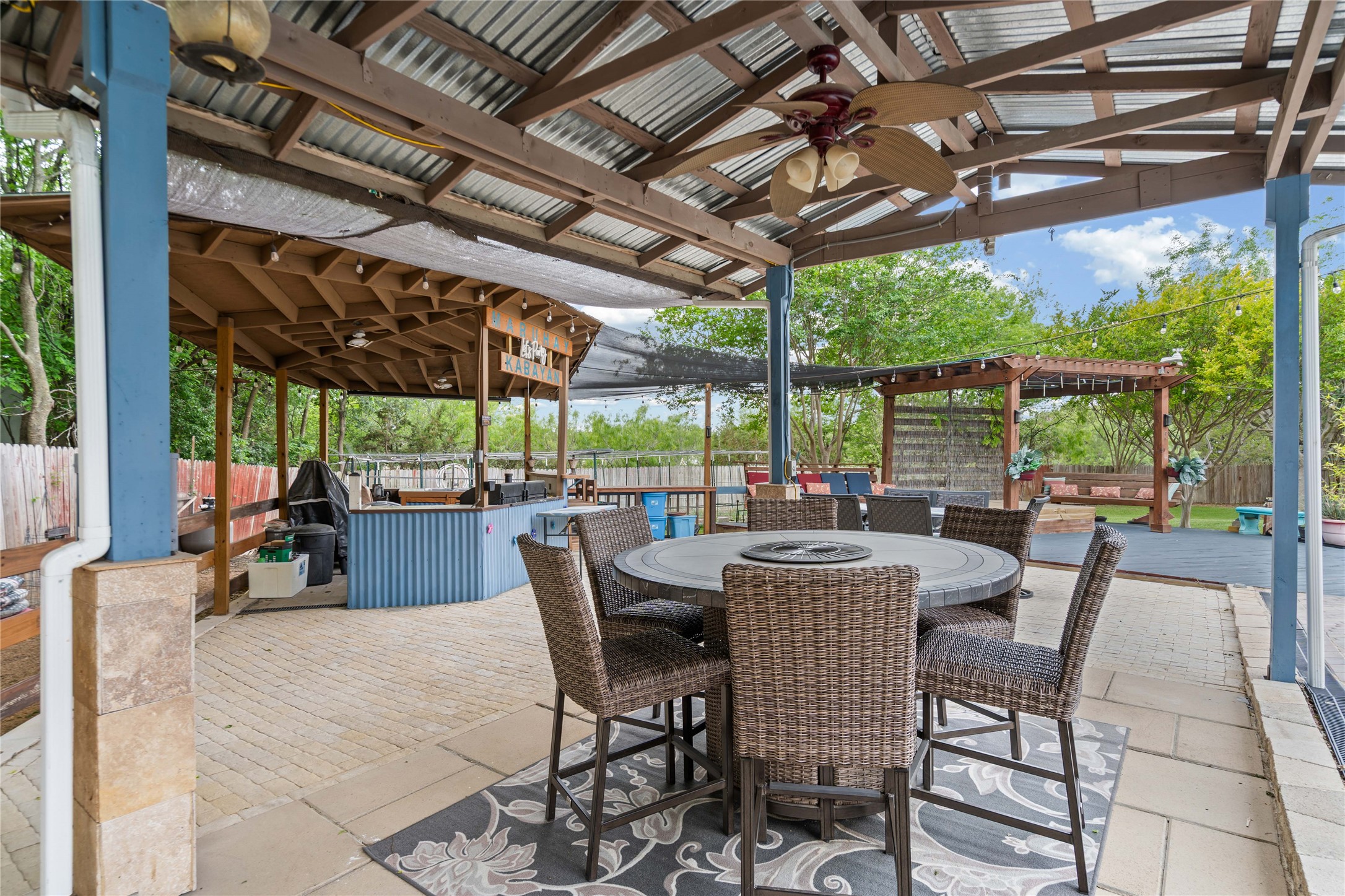 315 Appleton Court Buda, TX 78610 - Photo 18 of 28 a view of a patio with chairs and a table