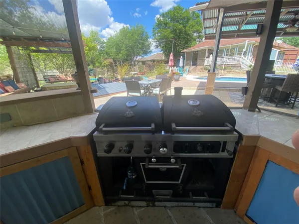a front view of a house with outdoor seating