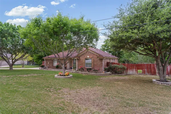 a house with trees in the background
