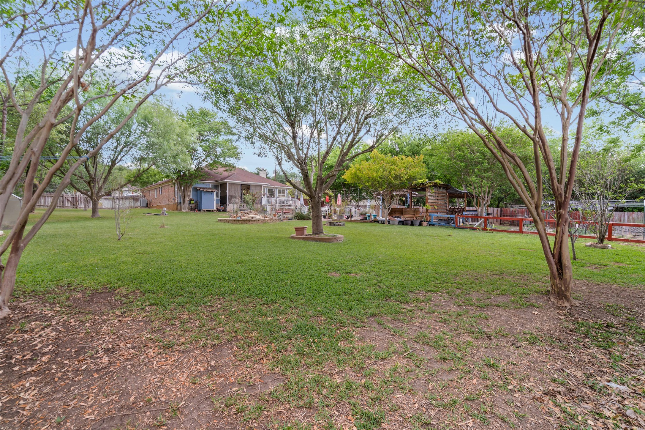 315 Appleton Court Buda, TX 78610 - Photo 22 of 28 a view of a house with a big yard and large trees