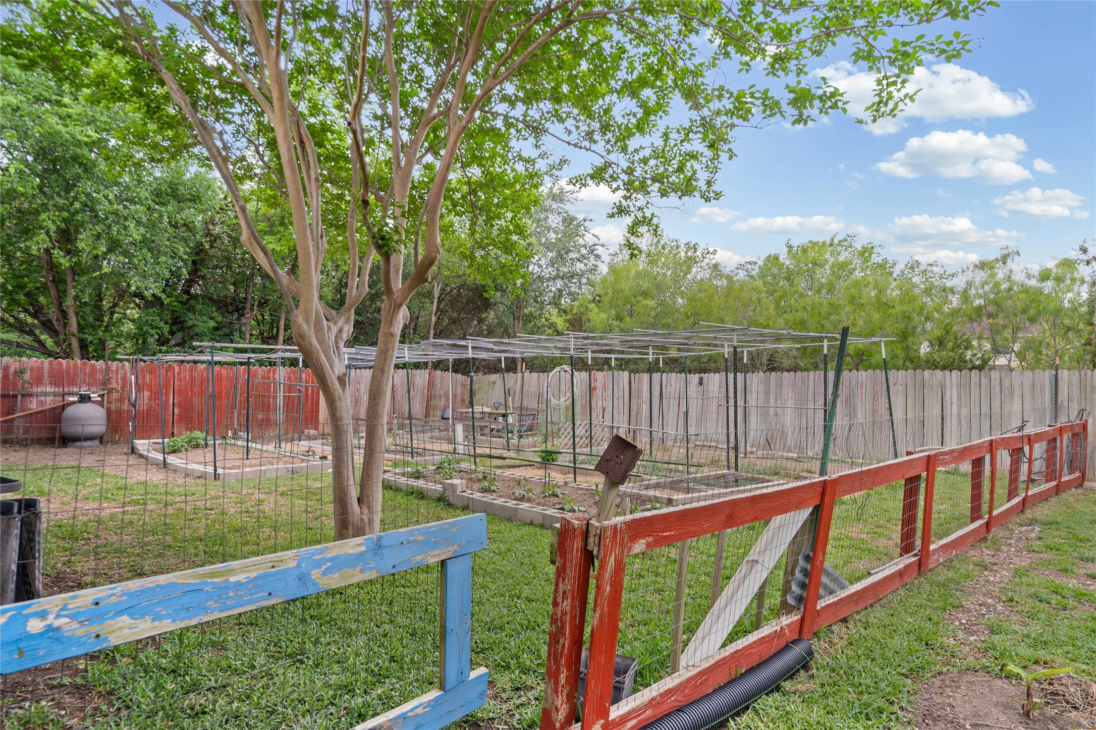 315 Appleton Court Buda, TX 78610 - Photo 27 of 28 a view of a wooden deck and a backyard
