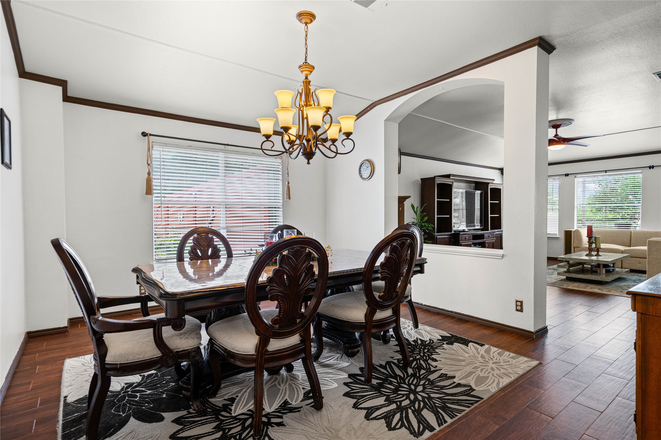 315 Appleton Court Buda, TX 78610 - Photo 7 of 28 a view of a dining room and livingroom with furniture wooden floor a chandelier
