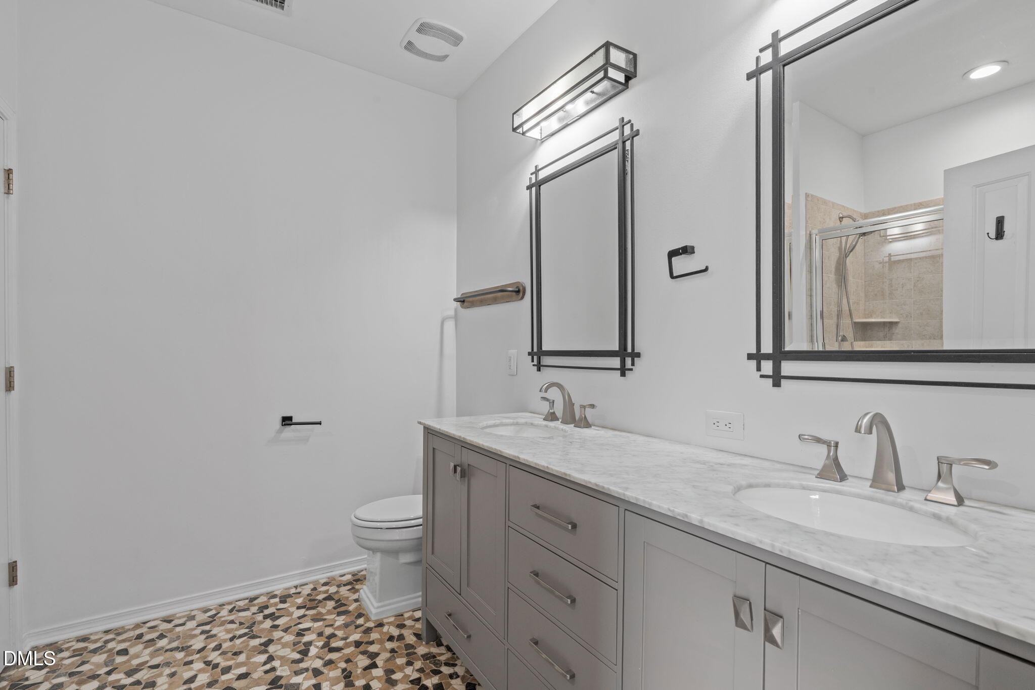 124 Daneborg Road Durham, NC 27703 - Photo 12 of 40 a bathroom with a granite countertop sink a toilet and a mirror