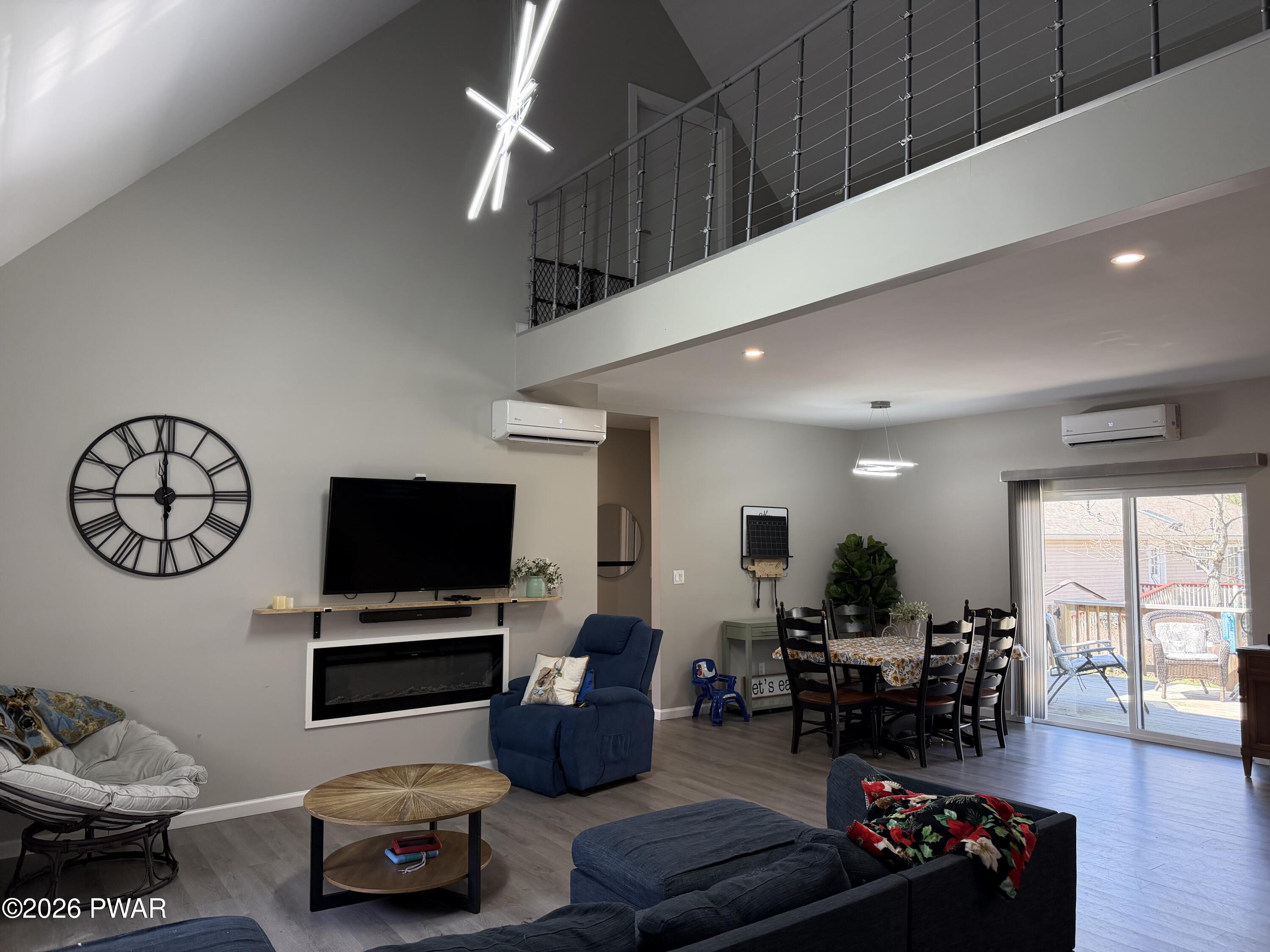 801 Maple Ridge Court Hawley, PA 18428 - Photo 11 of 55 a living room with furniture and a flat screen tv