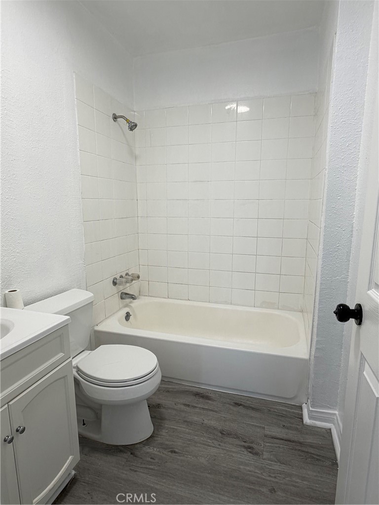 304 West Cedar Street Compton, CA 90220 - Photo 3 of 9 a bathroom with a bathtub toilet and sink