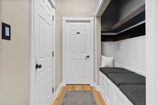 a bathroom with a granite countertop sink a mirror and a shower
