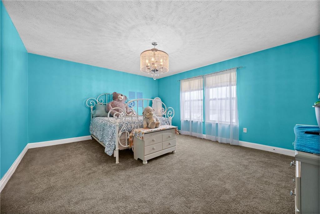 108 Stallion Road Clinton, PA 15026 - Photo 29 of 49 a bed room with a bed and a window