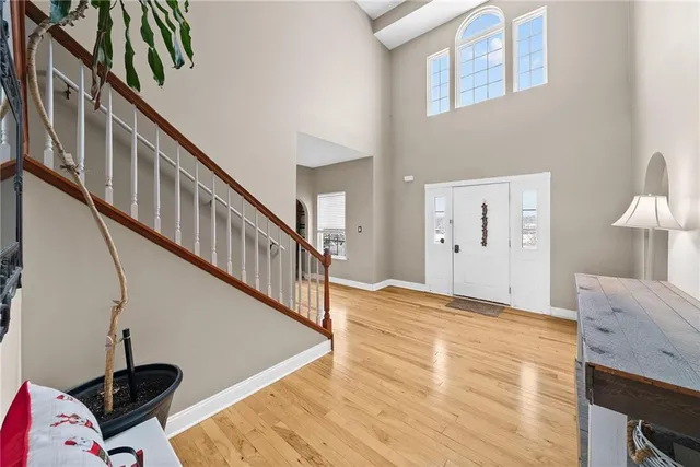 a view of an entryway with wooden floor