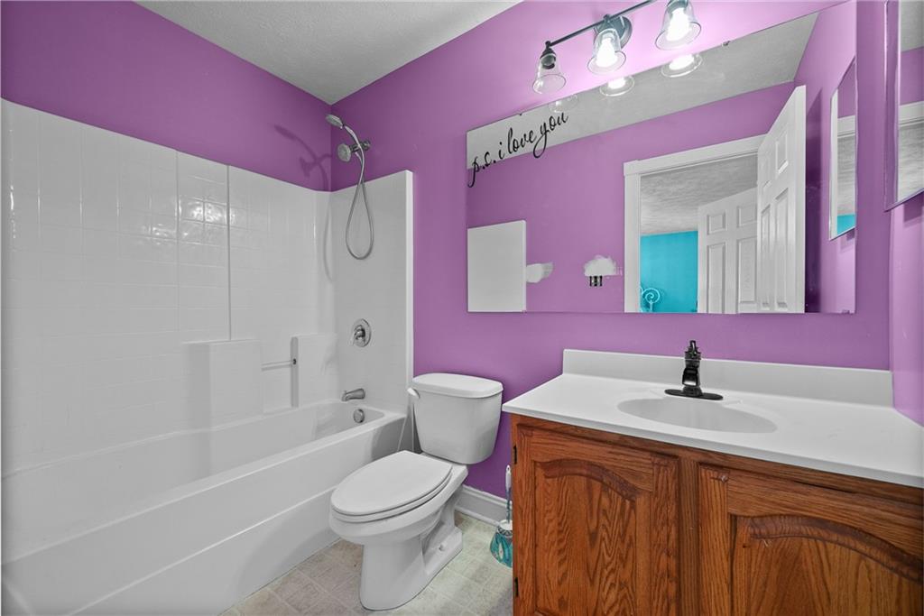 108 Stallion Road Clinton, PA 15026 - Photo 31 of 49 a bathroom with a sink a toilet a mirror and vanity