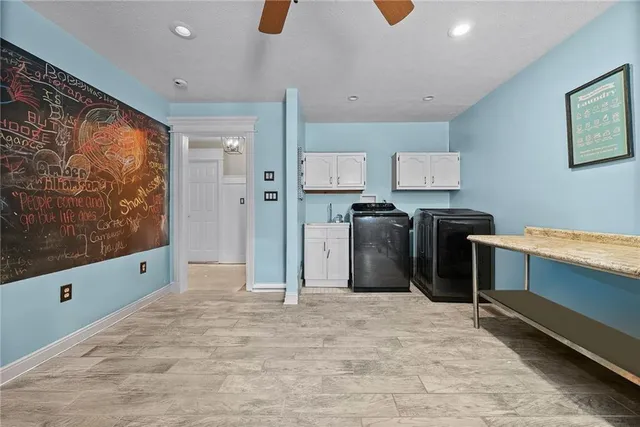 a kitchen with stainless steel appliances kitchen island granite countertop a refrigerator and a stove top oven