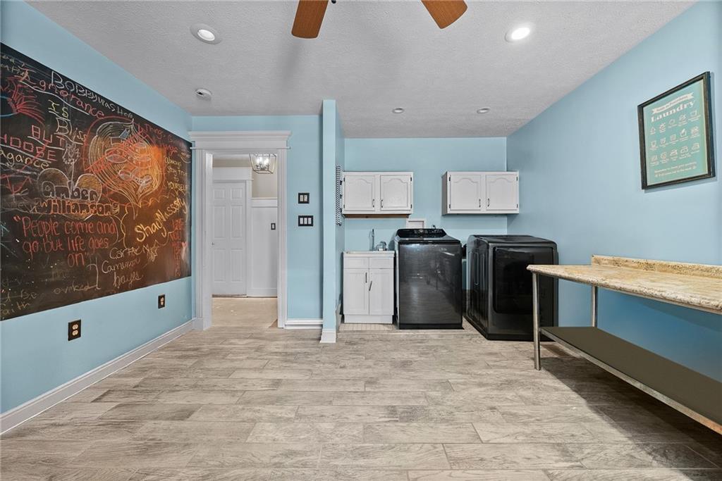 108 Stallion Road Clinton, PA 15026 - Photo 34 of 49 a kitchen with stainless steel appliances kitchen island granite countertop a refrigerator and a stove top oven