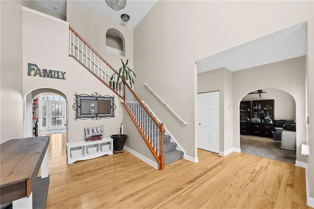 a view of a livingroom with furniture and staircase