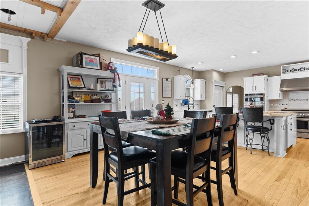 108 Stallion Road Clinton, PA 15026 - Photo 7 of 49 a view of a dining room with furniture and wooden floor