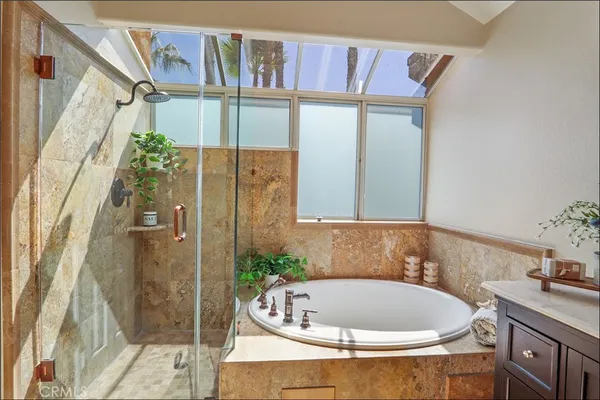 a bathroom with a glass shower door