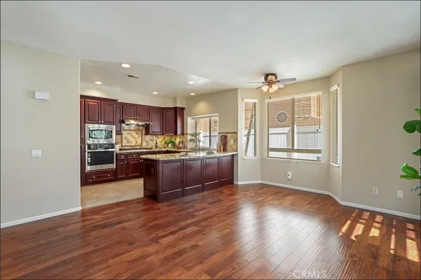 a kitchen with stainless steel appliances granite countertop a stove and refrigerator