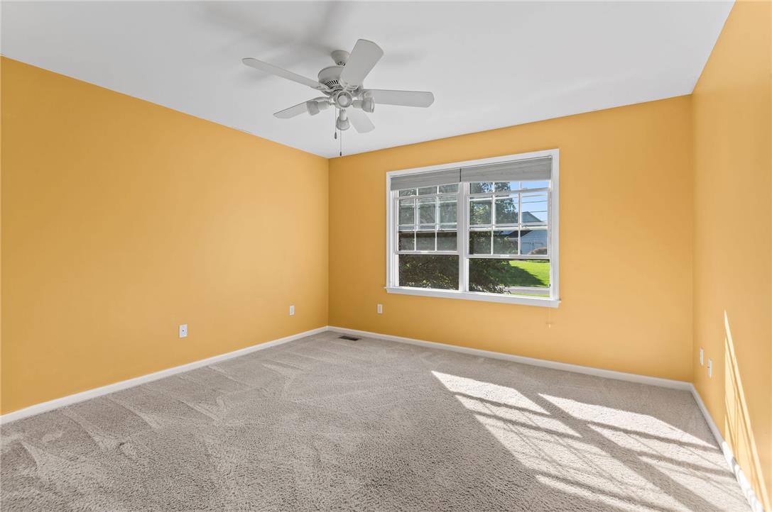 2617 Rising Sun Road Slatington, PA 18080 - Photo 26 of 58 A spacious bedroom features wall-to-wall carpeting and a wide window overlooking the yard.