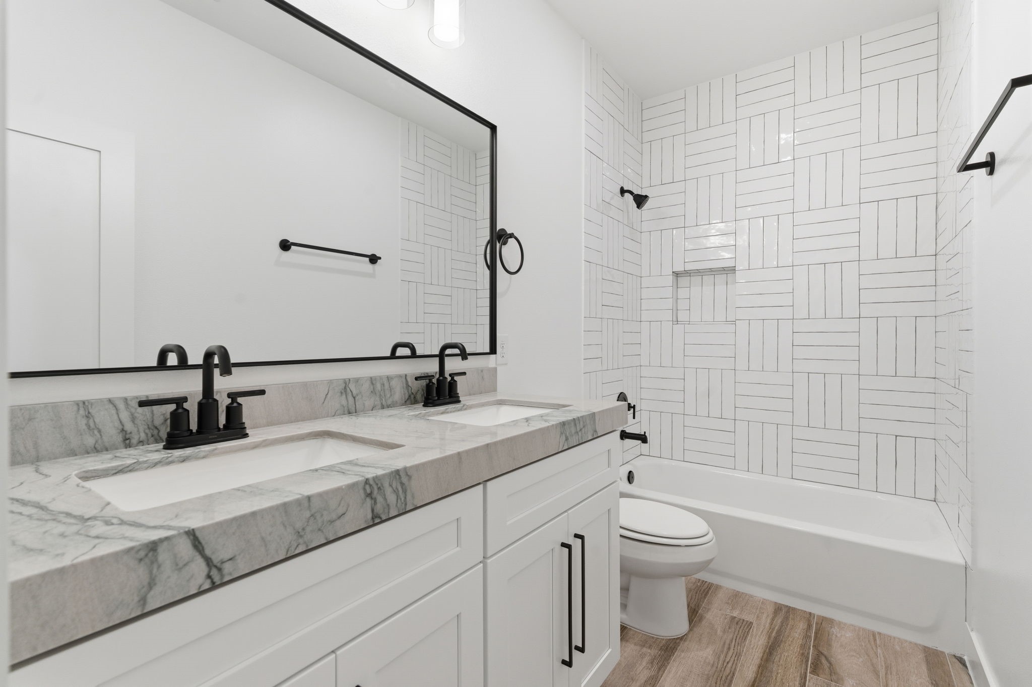 5227 Sunshine Point Willis, TX 77318 - Photo 23 of 33 HALL BATH HAS CUSTOM TILE AND DOUBLE SINKS WITH GORGEOUS COUNTER AND FIXTURES