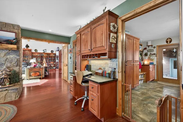 a spacious bathroom with a double vanity sink a toilet a mirror and shower