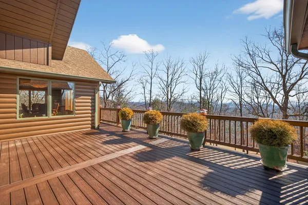 a living room with lots of furniture and paintings on the wall