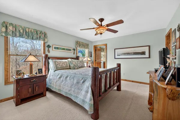 a view of a house with a yard and garage