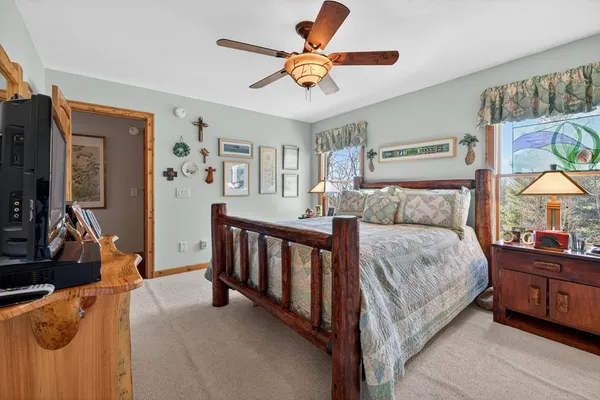 a view of a house with large space and a car parked in front of it