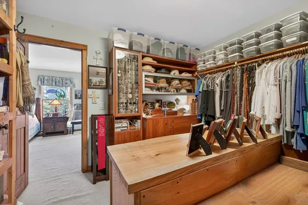 a view of a porch with a table and chairs