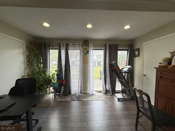 a kitchen with stainless steel appliances granite countertop a refrigerator and a stove
