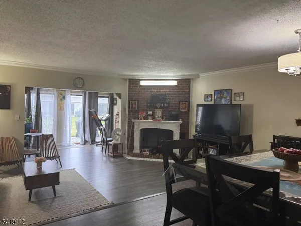 a living room with furniture a rug and a fireplace